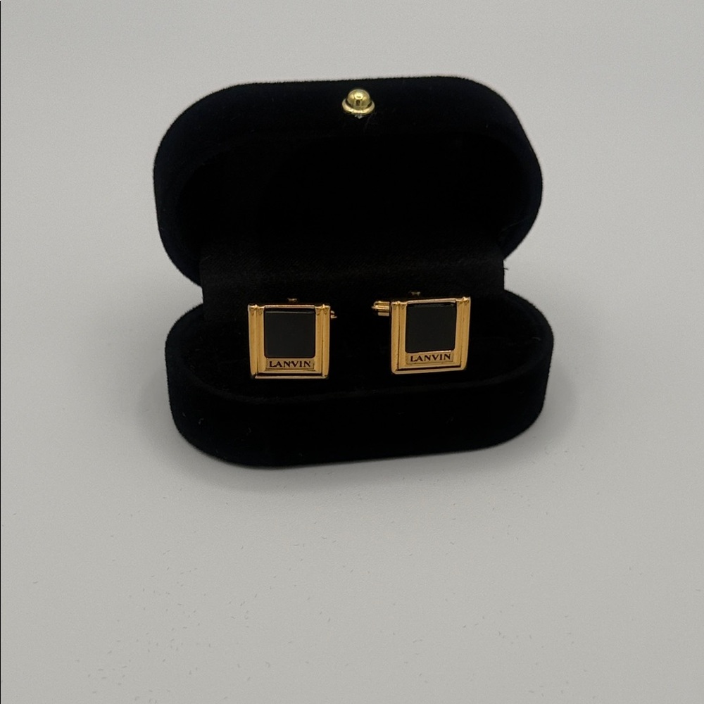 Lanvin brand gold-plated cufflinks featuring a black onyx stone